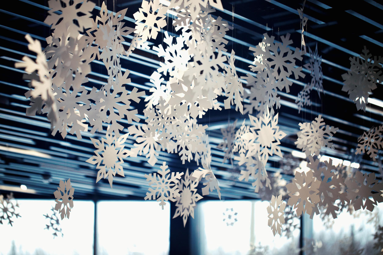 Christmas decoration snowflakes on the ceiling in the office